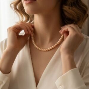 Graduated Cultured Peach Necklace. Peach color with Sterling Silver Clasp